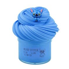 a blue cup filled with yarn on top of a white background and an image of a cartoon character in the bottom right corner