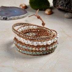 "Hand beaded and stitched on genuine leather. This unique wrap bracelet is designed to wrap around the wrist up to five times. Three adjustable closures measure approx. 33\", 34\", 35\" Exquisite workmanship! Material: Semi-baroque cultured freshwater pearls, blue jasper, and iridescent crystals. Clasp: SIlver tone toggle clasp. https://www.etsy.com/shop/MYGEMSROCK" Adjustable Hand Wrapped Leather Wrap Bracelet, Bohemian Beaded Leather Wrap Bracelet, Bohemian Hand Wrapped Leather Wrap Bracelet, Wrap Armband, Blue Jasper, Iridescent Crystal, Statement Bracelet, Freshwater Cultured Pearls, Rose Quartz Crystal