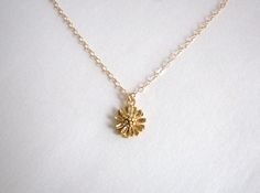 A small gold flower with lots of detail is hung on a delicate yet sturdy 14K Gold-Filled Chain. Sweet and simple. Feminine and charming. - Pendant - 14k Gold plated Brass - 9mm in diameter - Chain + components - 14K Gold-Filled - Clasp - 14K Gold-Filled lobster clasp . . . . . . . . . . . . . . . . . . . . . . . . . . . . . . . . Want more for bridesmaids, sisters or friends? I am happy to put custom orders together! . . . . . . . . . . . . . . . . . . . . . . . . . . . . . . . . Necklace arrive Delicate Yellow Gold Flower Necklace, Gold Flower Necklace For Anniversary, Tiny Gold Flower-shaped Jewelry, Dainty Gold Jewelry With Flower Decoration, Dainty Gold Flower Necklace For Anniversary, Delicate Gold Flower Charm Necklace, Delicate Gold Flower Necklace With Flower Charm, Delicate Gold Flower Necklace With Charm, Delicate Gold Flower Necklace