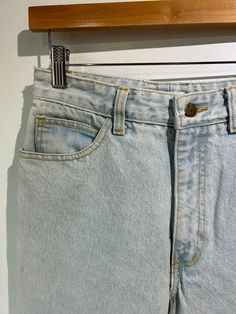 Vintage Georges Marciano for Guess Light Wash Jeans. High-waisted cut with legs that taper. Zippered slits at each ankle. In excellent vintage condition. Marked size 30 (but see measurements). Made in the USA. 100% cotton, machine wash warm. Approx. Measurements: Waist: 29" Length: 37.5" Inseam: 26" Rise: 12" Fitted Bottoms With Frayed Hem And Tapered Leg, Fitted Tapered Leg Bottoms With Frayed Hem, Classic Light Wash Tapered Leg Bottoms, Classic Tapered Leg Light Wash Bottoms, Retro Wide-leg Bottoms With Frayed Hem, Retro Wide Leg Bottoms With Frayed Hem, Vintage Wide-leg Bottoms With Frayed Hem, Retro Straight Leg Bottoms With Frayed Hem, Classic Tapered Leg Bottoms With Frayed Hem