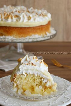 a piece of cake with white frosting on a plate