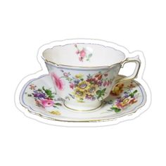 a tea cup and saucer with flowers on it