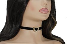 Soft to touch and pretty looking white velvet choker collar with a rhinestone silver plated or gold plated heart pendant charm. Choker necklace length is 33cm = 13 inch with adjustable 6 cm = 2 3/8inches chain. Velvet 10mm = 0.39 inches wide. Rhinestone heart about 2.6x2.4cm = 1.02x0.94 inches. Please, contact me if you need different length of the necklace. More chokers you can find here https://www.etsy.com/shop/lorArtstudio/edit?ref=seller-platform-mcnav&section_id=22503134 Thank you for stopping by my shop! I hope you have found something that you love!   Add my shop to your favorites and you'll get notifications about new jewelry and promotions Velvet Necklace, Charm Choker Necklace, Gold Heart Pendant, Black Velvet Choker, Necklace Collar, Heart Pendant Gold, Velvet Choker, White Velvet, Valentines Day Gifts For Her