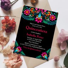 a black and pink floral quinceauera party card on top of an envelope