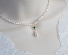 Vintage, Romantic Style Emerald Necklace, Wedding Pearl and Emerald CZ Bridal Choker, Emerald CZ Vintage Swarovski Pearl Necklace  Materials used: - White/Ivory Cream Swarovski pearls - cubic zirconia stones - gold plated over brass The necklace will arrive packaged ready for gift giving in a delicate white jewelry box with a silver ribbon. Matching earrings for this necklace:  Back to my shop http://www.etsy.com/shop/crinadesign73 Thank you for visiting my store! Emerald And Pearl Necklace, Vintage Pearl Necklace, Swarovski Pearl Necklace, Pearl Necklace Vintage, Diy Jewelry Unique, Bridal Choker, Silver Ribbon, White Jewelry Box, Necklace Wedding