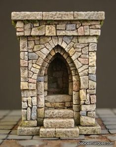 a small brick fireplace with a door on the top and bottom part is made out of bricks