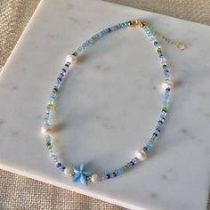 Under The Sea Freshwater Pearl Necklace | Summer Necklace | Beach Jewelry | Beaded Necklace | Coconut Girl Aesthetic | Seed Bead Jewelry by myearthyaura on Etsy Cheap Blue Necklaces For The Beach, Cheap Beach Jewelry With Heart Beads, Cheap Beaded Beachy Necklaces For Beach Season, Cheap Beaded Strand Necklace For Beach, Cheap Blue Necklaces For Beach, Cheap Beach Jewelry With Gemstone Beads, Cheap Dangling Beads Necklace For Beach, Cheap Glass Beaded Necklaces For Beach, Cheap Beaded Pearl Necklace For Beach