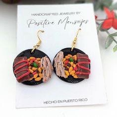 "No need to wait for Christmas!" These earrings were made to resemble the ever so popular Puerto Rican Christmas dish: Arroz Con Gandules, Pasteles and Pernil Asado! Yummy! Choose from two different styles. The earrings were carefully handcrafted with polymer clay and sealed with varnish for protection. Each charm measure approximately 1-1/8″ all around. The hooks are golden and made of Stainless Steel.  They will make a funny gift for someone who makes the best Christmas dish or loves eating a lot of Puerto Rican food. Since each earring is made by hand without any molds, there will be a difference in size, color and details than what is pictured.  Ships directly from our beautiful island! Contains small parts, do not give to small children. Traditional Puerto Rican Food, Puerto Rican Christmas, Puerto Rican Food, Arroz Con Gandules, Kitchen Handmade, Puerto Rico Art, Rican Food, Rice And Peas, Cool Piercings