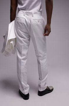 A slim fit lends contemporary appeal to bright-white tuxedo pants made from smooth, stretch-woven fabric. Zip fly with hook-and-bar closure Side-seam pockets; back button-welt pockets 77% polyester, 17% viscose, 6% elastane Machine wash, line dry Imported White Slim Fit Dress Pants For Business Casual, White Slim Fit Tuxedo With Notch Lapel, White Slim Fit Suits For Workwear, Elegant Fitted White Dress Pants, Classic White Slim Fit Tuxedo, White Tuxedo Style Work Pants, White Tuxedo Pants For Work, White Suits With Straight Pants For Workwear, White Slim Fit Straight Leg Dress Pants