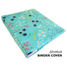 a blue binder with flowers on it and the words, stretch binder cover