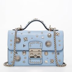 Order this light blue studded bag today with free shipping and returns. This sky blue crossbody is stylish with it's unique silver appliqués metals and silver hardware. It can be worn over the shoulder, by the handle, or as a crossbody. Blue Leather Bag, Hollywood Lights, Leather Crossbody Bag Small, Small Leather Bag, Studded Bag, Blue Purse, Stylish Baby, Bag Light, Studded Leather