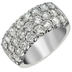 a white gold ring with rows of diamonds