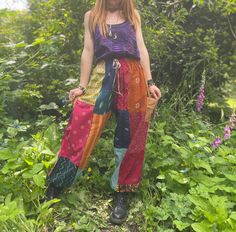 These gorgeous harem trousers are hand crafted using traditional Indian textile patches in autumn earthy tones. So funky, easy to wear and each pair is unique. So comfortable to wear out exploring in nature or chilling at home. Available as one size with tie elasticated waist. Details and colour may vary due to the handmade nature of this garment. Measurements  This is a Free Size/ One Size garment and the Model is size UK 8 Around Waist: 24" - 46" (61 - 117cm) max. Around Hips: 50" (127cm) Wais Hippie Pants Outfit, Hippie Trousers, Hippie Fits, Indian Patchwork, Purple Pixie, Loose Fit Pants, Sewing Fashion, Harem Trousers, Hippie Pants