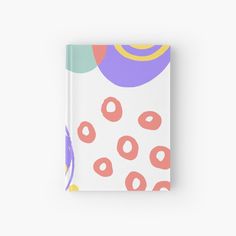 a book with an image of donuts and balloons on the cover, in pastel colors