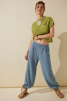 Perfectly paired and just as effortless, this essential set from our free-est collection features a knit top and coordinating tapered pants for the perfect wear-everywhere outfit. **Top:** * Rib-knit fabrication * Funnel neckline * Front pouch pocket * Boxy fit **Pants:** * Pull-on design * Exaggerated pleating at top * Side pockets * Banded hemlines | Freya Sweater Set by free-est at Free People in Green, Size: XS Casual Viscose Bottoms For Day Out, Versatile Cropped Bottoms For Loungewear, Solid Cropped Pants For Loungewear, Solid Cropped Loungewear Pants, Casual Loungewear Viscose Pants, Casual Knit Bottoms With Pockets, Chic Summer Knit Pants, Casual Solid Cropped Pants, Casual Solid Color Cropped Pants