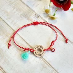 This March Charm Bracelet, Red and White Cord Bracelet, is handmade with love from Greece. This fashionable spring bracelet is a variation of Greek traditional "March" Bracelet. It consists of a wooden charm "Martis" motif,  knotted with a braided red and white waxed thread  and adorned with a red enamel evil eye charm. Moreover, a cute teal tassel adds a playful touch to this folk bracelet. It's adjustable, with a slide macrame knot, in order to fit any wrist size. The ideal spring gift for a g Handmade Red Charm Bracelet As Gift, Red Bohemian Charm Bracelet For Gift, Bohemian Style Red Charm Bracelet For Gift, Handmade Red Beaded Bracelets For Gift, Handmade Red Charm Bracelet, March Bracelet, Greek Bracelet, Spring Bracelet, Country Wear