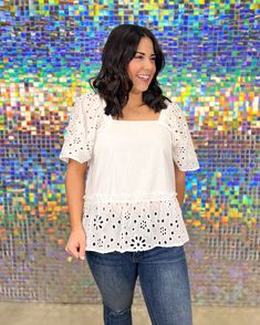 The Kieran Eyelet Top is a stunning poplin top designed for women who appreciate style and femininity. Delicate eyelet sleeves and a flounce hem with an exposed ruffle seam add an elegant touch to the overall look. Fit Description Small: 4/6 Medium: 8/10 Large: 12/14 Chic Cotton Eyelet Blouse, Chic Cotton Blouse With Eyelet Details, Chic Fitted Eyelet Blouse, Chic Cotton Blouse With Cutwork Hem, Feminine Spring Top With Cutwork Hem, Chic Spring Eyelet Blouse, Feminine Eyelet Tops For Spring, Feminine Spring Tops With Cutwork Hem, Chic Spring Tops With Cutwork Hem