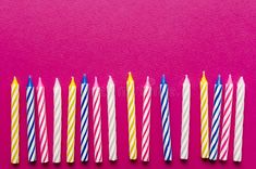 five birthday candles lined up in a row on a pink background royalty images and stock photos