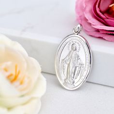 "Sterling silver Miraculous Medal necklace charm, high quality unisex Miraculous Medal necklace, gold filed Our Lady of Grace charm pendant Sterling silver 925 Miraculous Medal with rhodium plated protection. This medal is made with special \"coin\" technology so each detail is very well exposed and precise. Edge of this medal is diamant cuted so it gives to medal shiny and glossy look. In order to find ideal medal for everyone we can offer variation of six different sizes. Our recommendation is Silver Miraculous Medal Jewelry As Gift, Silver Necklace With Miraculous Medal For Gift, Silver Necklace With Miraculous Medal As Gift, White Gold Necklace With Miraculous Medal For Gift, White Gold Necklace With Miraculous Medal As Gift, Silver Tarnish-resistant Round Pendant Charm, Silver Tarnish Resistant Charms For Gift, Sterling Silver Tarnish Resistant Charms, Gift Coin Pendant Charm