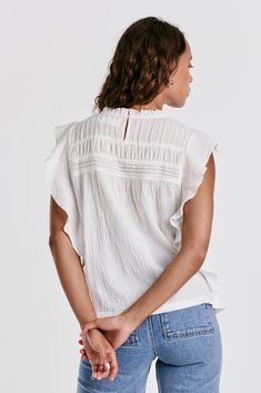 Ruffle sleeve & neck top, crew neck with back keyhole in front & back pleated yoke. Solid color woven on relaxed fit. Carefree & wholesome, stylish details embracing the essence of nature's beauty.Body length from HPS: 24 1/2", Sleeve ruffle: 3", Bust: 39" (Size Small) 100% COTTON Machine wash cold, Tumble dry low Imported Effortless White Top For Casual Gatherings, White Spring Blouse For Casual Gatherings, Cotton Blouse With Relaxed Fit And Flutter Sleeves, Cotton Blouse With Flutter Sleeve And Relaxed Fit, White Casual Blouse For Casual Gatherings, Relaxed Fit Cotton Blouse With Flutter Sleeves, Relaxed Fit Crew Neck Blouse For Daywear, White Crew Neck Top For Casual Gatherings, Chic White Tops For Casual Gatherings