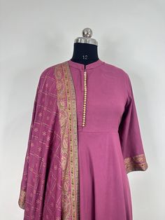 Product Details Levender Pink printed Anarkali style Kurta with Palazzos & dupatta Kurta design: Ethnic motifs embroidered * Anarkali shape * Pleated style * Round neck, three-quarter regular sleeves * Sequined detail * Calf length with flared hem * Viscose rayon fabric Palazzos design: *Bandhani printed Palazzos *Elasticated waistband * Slip-on closureDupatta: Bandhani printed * Tasselled border Material & Care Kurta: Viscose Rayon Dupatta: Viscose Rayon Machine Wash Trouser: Viscose Rayon Items Includes: One Piece Kurta One piece Dupatta One Piece Palazzo. Note:- Please see the size chart in the image to choose a perfect size. Please feel free to ask any questions regarding this item WE ALSO ACCEPT CUSTOMISATION AS PER CUSTOMER REQUESTS. Maxi Kurta With Cutdana For Transitional Season, Transitional Maxi Kurta With Cutdana Detail, Maxi Length Kurta With Cutdana Detail For Transitional Season, Anarkali Set With Cutdana On Jamawar Fabric, Anarkali Set In Jamawar With Cutdana, Jamawar Anarkali Set With Pallu, Anarkali Churidar In Jamawar For Navratri, Anarkali Style Jamawar Churidar, Traditional Long Sleeve Anarkali Set With Dabka Work