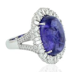 For Sale on 1stdibs - This stunning ring has been meticulously crafted from 18-karat white gold. It is centered with 20.0 carats tanzanite, illuminated with 1.77 carats of glittering Luxury Tanzanite Diamond Ring, Luxury Oval Tanzanite Diamond Ring, Luxury Tanzanite Diamond Ring With Brilliant Cut, Luxury Tanzanite Diamond Ring Gia Certified, Luxury Gia Certified Tanzanite Diamond Ring, Luxury Tanzanite Diamond Ring For Formal Occasions, Luxury Tanzanite Diamond Ring Round Cut, Luxury Tanzanite Diamond Ring With Round Cut, Luxury Round Cut Tanzanite Diamond Ring