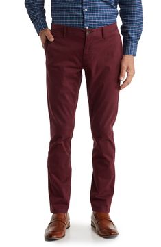 A solid hue makes these chino pants a versatile, everyday classic staple for your closet. 9" rise, 32" inseam (size 32x32) Trim fit Zip fly with button closure 2 front slash pockets; 2 back button welt pockets 97% cotton, 3% spandex Machine wash, tumble dry Imported Model stats: 6'1" height, 32" waist. Model is wearing size 32x32. Slim Fit Straight Leg Solid Chinos, Slim Fit Cotton Chinos For Business Casual In Fall, Solid Color Slim Fit Straight Leg Chinos, Slim Fit Straight Leg Chinos, Slim Fit Chinos For Business Casual In Fall, Fall Slim Fit Chinos For Business Casual, Straight Chinos With Welt Pockets In Chino Cotton Twill, Straight Chinos With Welt Pockets In Cotton Twill, Classic Fitted Chinos For Fall