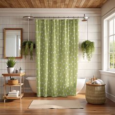 a green shower curtain with white polka dots