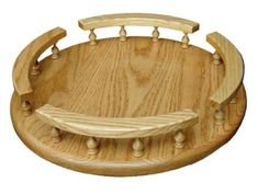 a wooden tray with handles and knobs on it