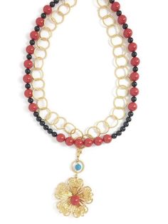 Sudipta is a gold-plated chainmeille necklace with a large gold-plated flower pendant. She also has a strand of crystal pearls in coral red and mystic black. Sudipta is a unique and exceptional jewelry. She is interchangeable, from short and double stranded, all cute and coy, to long and single stranded, bold and adventurous. And on some occasions you can remove the flower pendant for a more playful and fun avatar. Wear it on a simple cotton top or a red evening dress. Wear it short or long. Wea Pastel Top, Red Evening Dress, Chain Extenders, Coral Red, Pearl Strands, Gold Crystal, Pearl Pendant Necklace, Gold Plated Rings, Swarovski Pearls