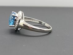 14k White Gold Fancy Cut Round Blue Topaz and Diamond Halo Ring Size 7 Appraisal Report Included Item w# 67 Clean and in good condition Ring can be sized by your local jeweler 2.80 ct Blue Topaz .12 cttw Diamonds Color I/J Clarity SI American Appraisal Association Estimated Retail value $695 Formal Trillion Cut Topaz Ring In Fine Jewelry Style, Formal Trillion Cut Topaz Fine Jewelry Ring, Formal White Gold Birthstone Ring With Topaz, Formal Trillion Cut Blue Topaz Ring, Formal Blue Topaz Trillion Cut Ring, Formal Topaz Birthstone Ring, Elegant Trillion Cut Topaz Promise Ring, Elegant Trillion Cut Topaz Ring, Filigree Ring Gold