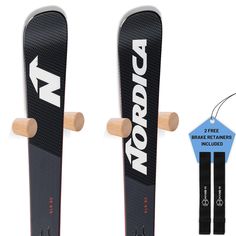 two snowboards with wooden handles and straps attached to the back of each board,