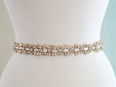 26" Jeweled part, Wedding Belt, Bridal Sash Belt - GOLD Clear Stone Champagne Stone  Vintage White Opal stone Wedding Sash Belt **JEWELED Applique size - approximately  26 1/4" long and 1" wide.   (widest point).  ** Self tie ribbon ties in the back. Total sash belt is measuring about 3.5 yards, 5/8" width wide.  ** Double face satin ribbon colors are available in White, Off White, Ivory, Black, Navy and Silver Grey, BLUSH    Please select the sash color from the drop-down menu **Due to all prod Gold Embellished Wedding Sash, Gold Embellished Sashes For Wedding, Gold Embellished Bridal Accessories For Wedding, Bridal Sash Belt, Tie Ribbon, Wedding Belt, Wedding Sash Belt, Stone Wedding, Belt Gold