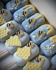 there are many honeycombs and bees on the cookies in the shape of soap