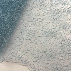 Corded Bridal Lace Fabric Embroidered on 100% Polyester Net Mesh | Lace USA - 90938W Blue Lace Tulle Fabric With Floral Embroidery, Elegant Blue Lace With Intricate Embroidery, Blue Lace With Lace Trim For Wedding, Blue Lace For Wedding, Elegant Blue Embroidered Lace Fabric, Blue Lace Embroidered Fabric, Blue Lace Embroidered Fabric With Lace Work, Elegant Blue Lace Tulle Fabric, Quinceanera Crown