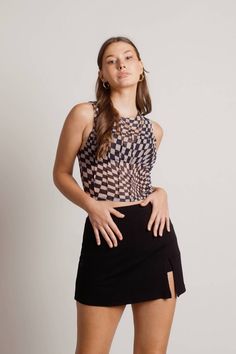 A checkered tank top with that winning look. The Black Sheer Mesh Checkered Tank Top for effortless style and maximum comfort. Shop TOBI clothing, mesh tank tops, and sheer tank tops in the hottest trends. Get the latest in women's tank tops in the most popular styles. Wavy Checkered Pattern, Street Ware, White Mesh Top, Candle Pedestal, Outfits Rave, Black Mesh Top, Sheer Tank Top, Mesh Tank Top, Concert Festival