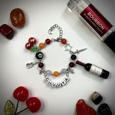 -Handmade Chuuya Nakahara inspired bracelet with dangling charms and name tag -Adjustable with semi-loose fit on smallest setting -Made with stainless steel, acrylic beads, and plastic charms -Take care when handling and do not tug on it, as it is handmade. May appear tangled occasionally but is easy to fix Bungou Stray Dogs Bracelet, Chuuya Bracelet, Kandi Necklace, Plastic Charms, Dog Bracelets, Anime Jewelry, Chuuya Nakahara, Stray Dogs Anime, Themed Jewelry