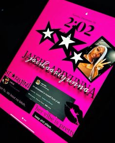 a pink poster with white stars on it and the number twenty two in front of it