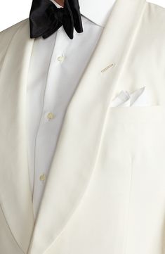 Classic in color, cut and composition, this cream-hued dinner jacket sets a polished course, tailored with a shawl collar and welt pockets from wool barathea. 30" length (size 40R) One-button closure Shawl collar Nonfunctional four-button cuffs Chest welt pocket; front welt pockets Side vents Cupro lining 100% wool Dry clean Made in Italy Men's Designer Clothing Tailored Tuxedo With Lapel Collar For Wedding, Luxury Cream Blazer With Notch Lapel, Elegant Tailored Tuxedo With Lapel Collar, Elegant Tuxedo With Single Button And Notch Lapel, Elegant Single Breasted Tuxedo With Notch Lapel, Elegant Tuxedo With Lapel Collar, Luxury Cream Blazer With Hidden Button Closure, Classic Long Sleeve Three-piece Suit For Wedding, Beige Suits With Lapel Collar For Formal Occasions