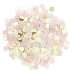 pink and gold confetti sprinkles in a pile on a white background