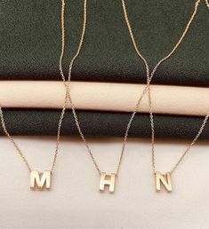 Discover the elegance of our 14k gold letter necklace, a perfect blend of sophistication and personalization. This dainty custom initial pendant is an ideal gift for any occasion, from birthdays to anniversaries, offering a timeless piece of jewelry that she will cherish forever. ✨ High-Quality 14k Gold: Made with genuine 14k gold for a luxurious and lasting shine. 🎁 Personalized Initial: Customizable with any letter of your choice to create a meaningful keepsake. 💎 Elegant Design: Features a Dainty Gold Jewelry, Gold Letter Necklace, Gold Letter, Gift For Her Birthday, Custom Initials, Gold Letters, Personalized Initials, Initial Pendant, Letter Necklace