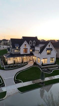 an aerial view of a large house at dusk