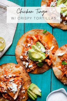 chicken tortillas with cheese, avocado and sour cream on a blue wooden table