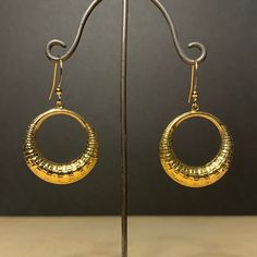 Here is a pair of beautiful, quite large, very light textured dangle hoops earrings. These are stamped on both sides as seen on last 2 photos These were actually made in the early seventies. They are good quality, new (unused) vintage items, made of gold plated brass. 27mm wide x 45mm high (with earwire) BOY19 IMPORTANT: please note that I offer different earwires as seen in second picture, and the price of the earrings vary depending on the chosen earwires.  It goes as follows: A: gold plated b 70s Earrings, Dangle Hoop Earrings, Hoops Earrings, Vintage Texture, French Wire, The Chosen, Etsy Earrings Dangle, 2 Photos, Base Metal