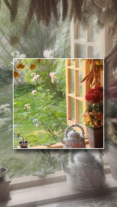 an open window with flowers and plants in the foreground, next to a potted plant