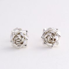 Rose Earrings, Sterling Silver Studs, Flower Earrings Individually handmade rose stud earrings with a small open rose design, a classic design for your be love . * Material: Sterling Silver * Size of Rose: Approx 1 cm (0.4in) diameter * Earring Type: Stud Earrings with butterfly back * Ready to Ship in 2-3 business day * Made in the United Kingdom PACKAGING: Comes uniquely packaged in my Magnolia Restrepo Style Case as shown in the last photo. Additional, I gift wrap all my boxes with golden pap Silver Rose Design Jewelry For Wedding, Silver Wedding Jewelry With Rose Design, Silver Bridal Earrings For Valentine's Day Wedding, Wedding Jewelry With Roses In Sterling Silver, Wedding Jewelry In Sterling Silver With Roses, Formal Rose Earrings With Rose Design, Sterling Silver Rose Design Jewelry For Wedding, Wedding Jewelry With Rose Design In Sterling Silver, Wedding Sterling Silver Jewelry With Rose Design