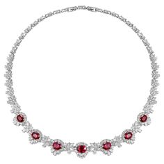 This exquisite necklace is a statement piece that exudes luxury and sophistication. Crafted in lustrous 18K white gold, it features a symphony of seven meticulously selected Mozambique rubies, weighing a total of 12.03 carats. These rubies, known for their deep red hue and remarkable clarity, are the stars of this necklace, each encased in a halo of dazzling diamonds. Enhancing the rubies' radiant beauty, the necklace is adorned with a collection of fancy-shaped diamonds, totaling 11.01 carats, Ruby And Diamond Pendant, Ruby Diamond Necklace, Ruby And Diamond Necklace, Radiant Beauty, Expensive Taste, Expensive Jewelry, Gold Necklace Designs, Ruby Diamond, Girly Jewelry