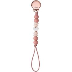 a pink and white pacifier is hanging from a cord with an inscription on it