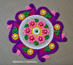 an intricately decorated paper plate with flowers on it