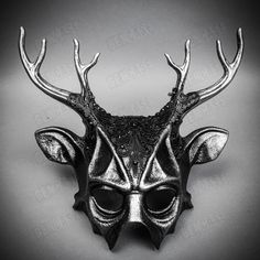 Mystery and allure with our Antler Deer Textured Horn with Laces Devil Halloween Masquerade Mask in Black. Perfect for anyone seeking an unforgettable Halloween costume or masquerade accessory, this mask combines the wild elegance of antler deer horns with the mysterious charm of a masquerade. Crafted from durable plastic, the mask features a textured design that mimics the aged look of antique artifacts, painted in a popcorn-textured black to enhance its appeal. Measuring approximately 14 inche Gothic Masks And Prosthetics For Carnival, Gothic Masks And Prosthetics For Carnival Fantasy Events, Gothic Horned Masks For Fantasy Events, Fantasy Horned Costume Accessories For Masquerade, Gothic Masks And Prosthetics For Halloween Theater, Black Novelty Costume Accessories For Fantasy Events, Fantasy Horned Masquerade Mask For Costume, Black Masquerade Mask For Halloween, Gothic Eye Mask For Fantasy Events